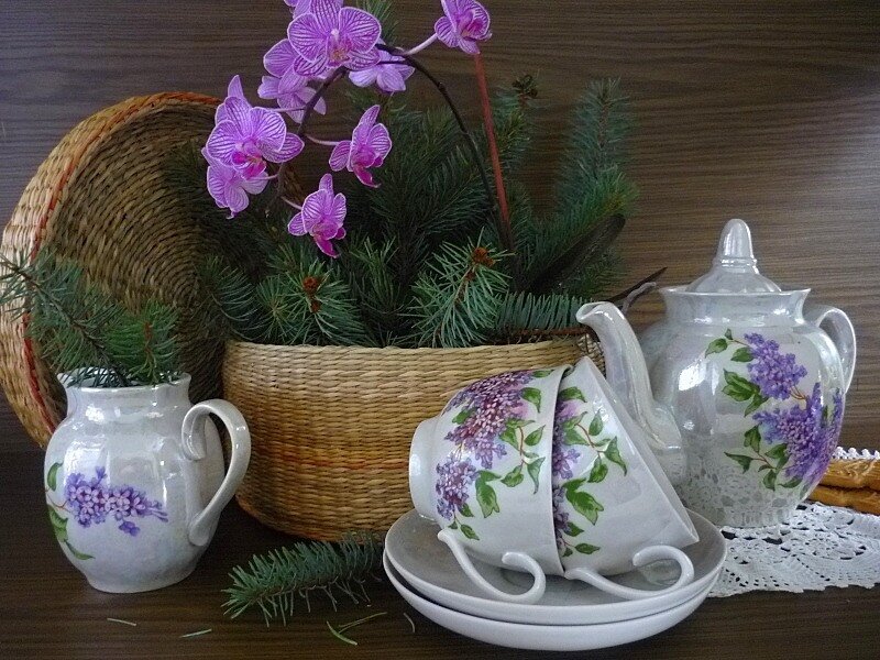 Tea set with flowers and basket