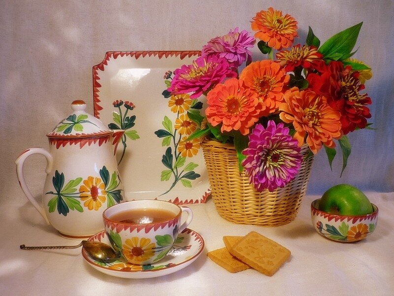 Tea set with flowers and cookies