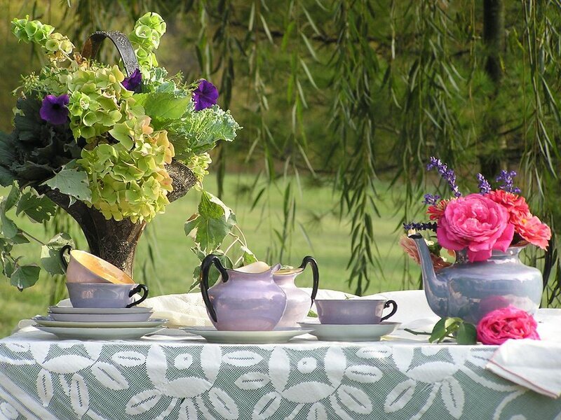 Tea set with flowers outdoors