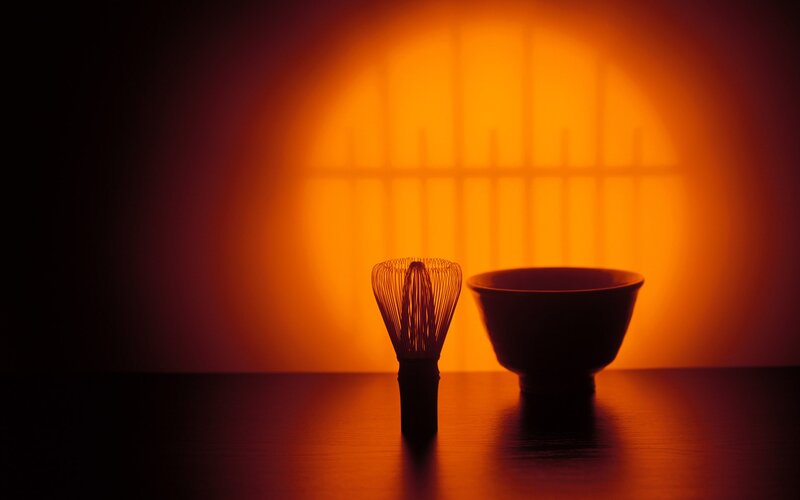 Tea whisk and bowl in warm light
