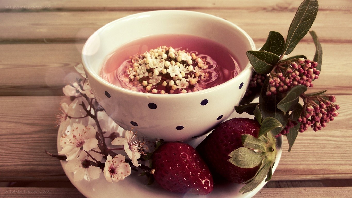 Tea with flowers and strawberries