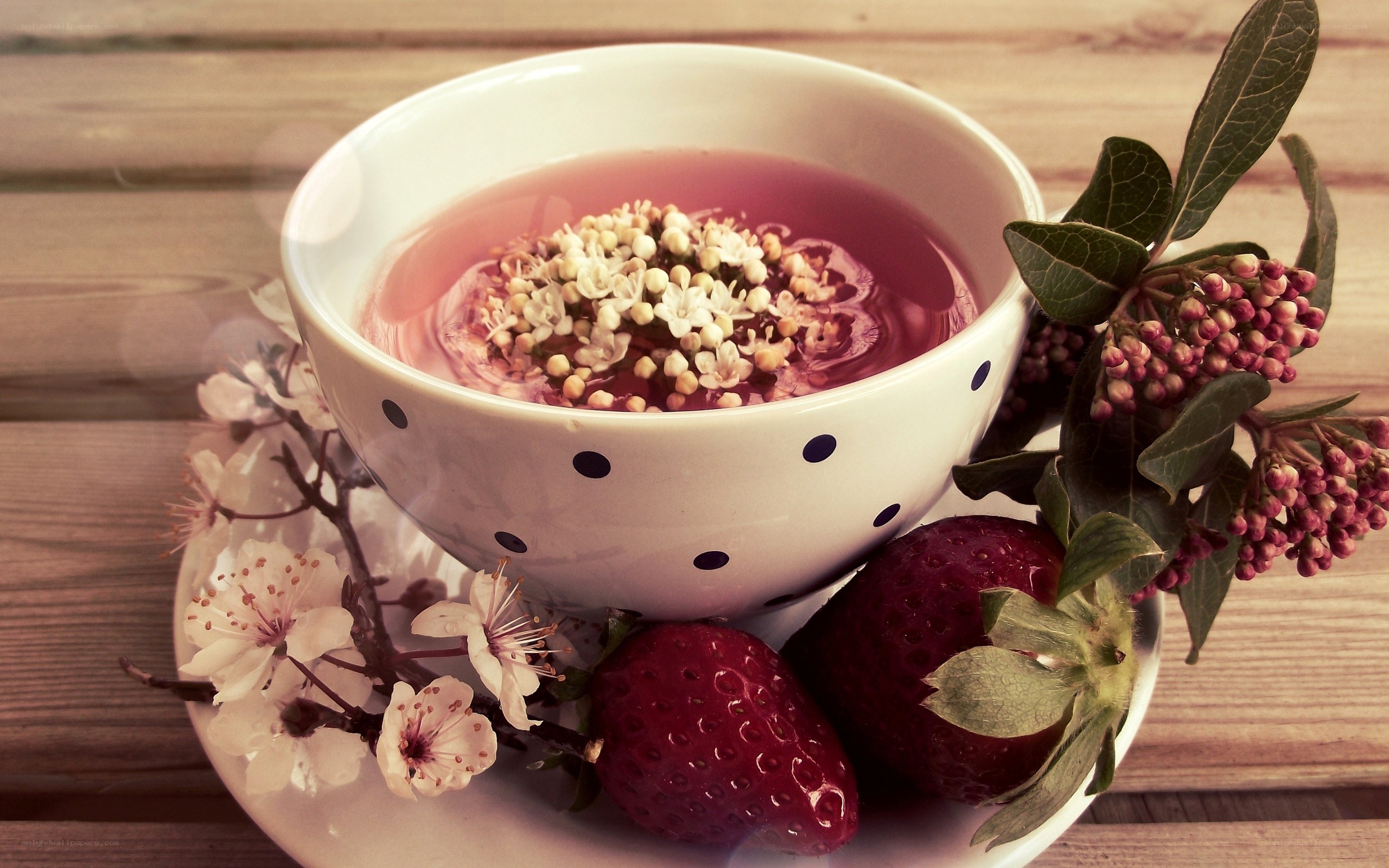 Tea with flowers and strawberries