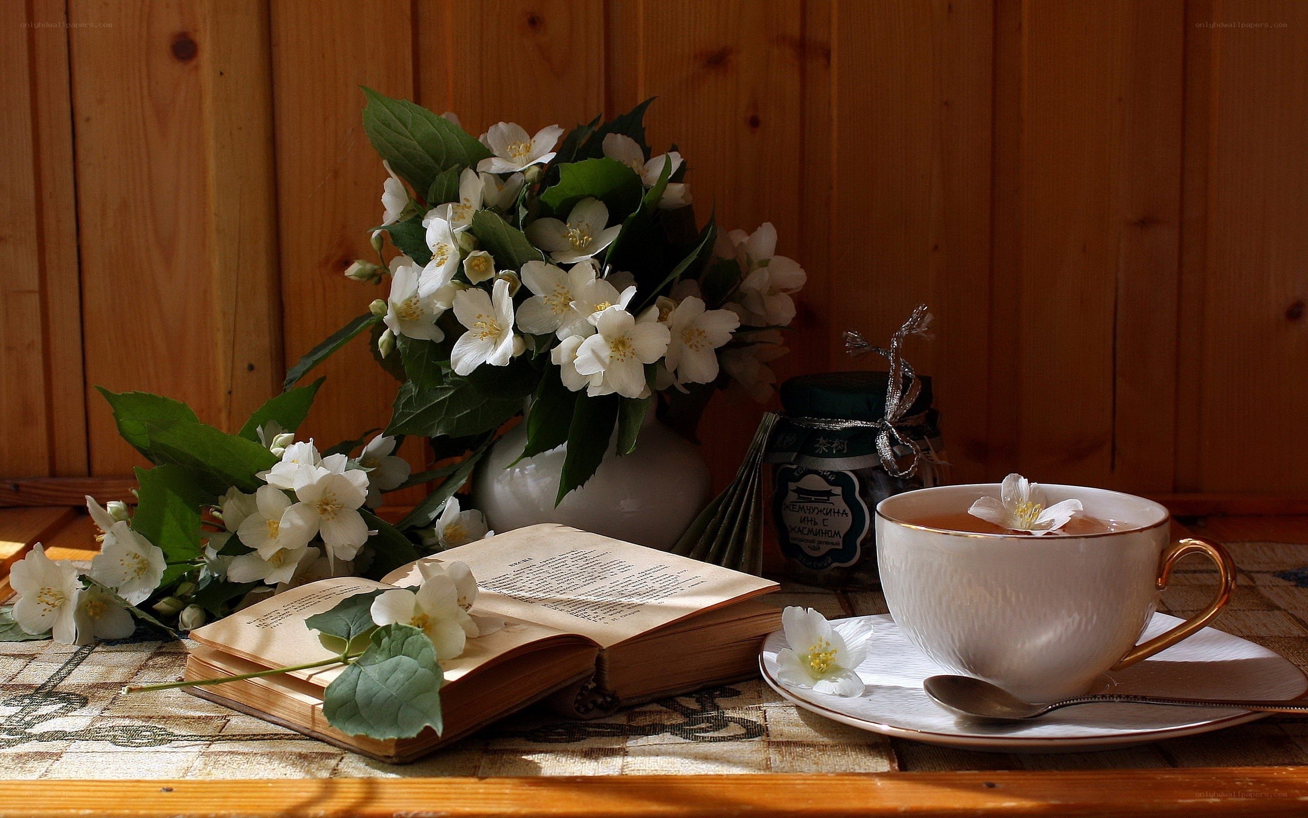 Tea with jasmine and a book