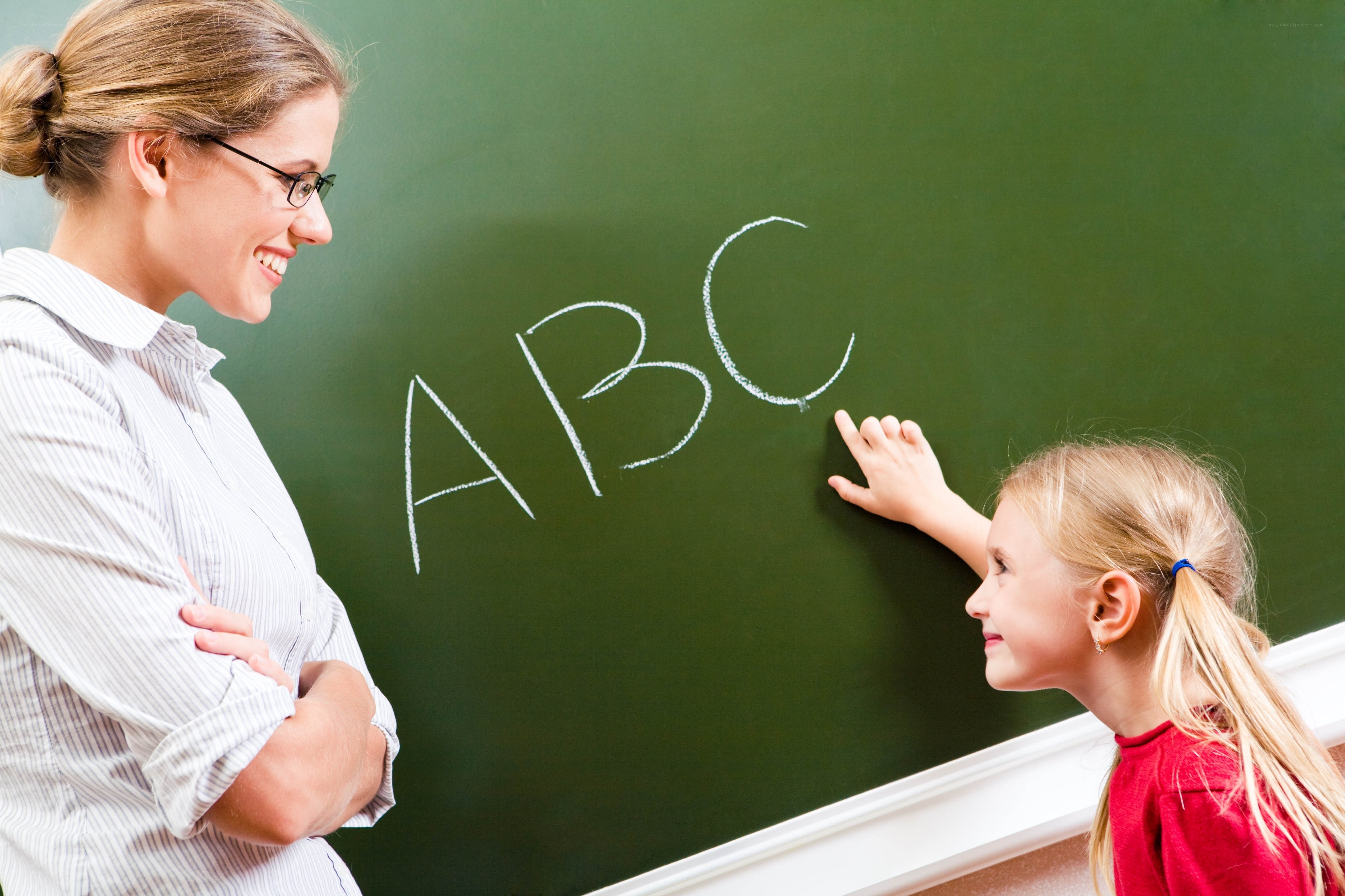 teacher and student at blackboard