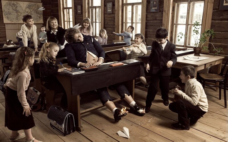 Teacher Asleep at Desk
