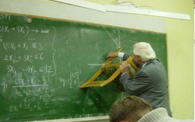 Teacher at Blackboard — Green