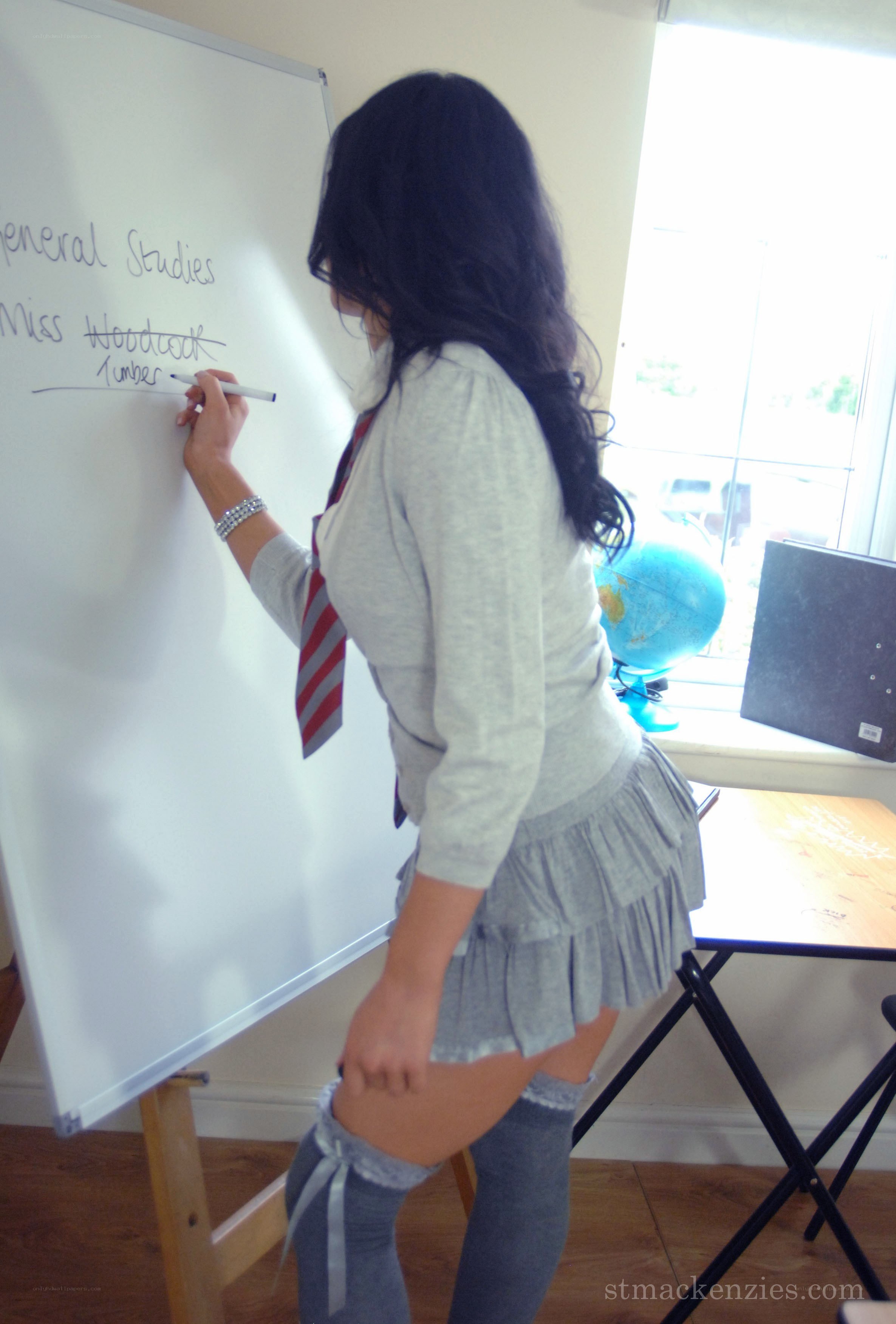 teacher writing on whiteboard