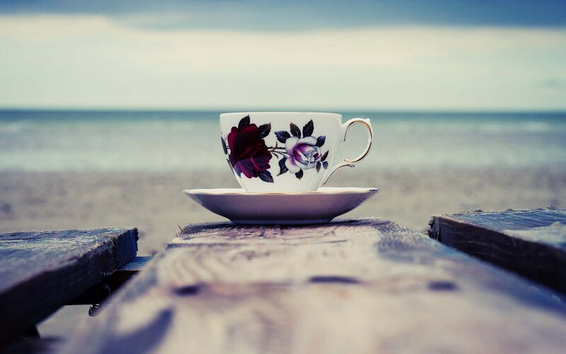 Teacup on a beach bench