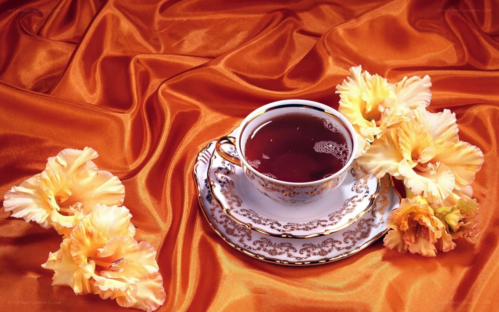 Teacup with flowers on silk