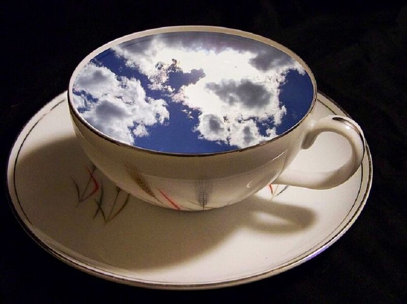 Teacup with sky reflection