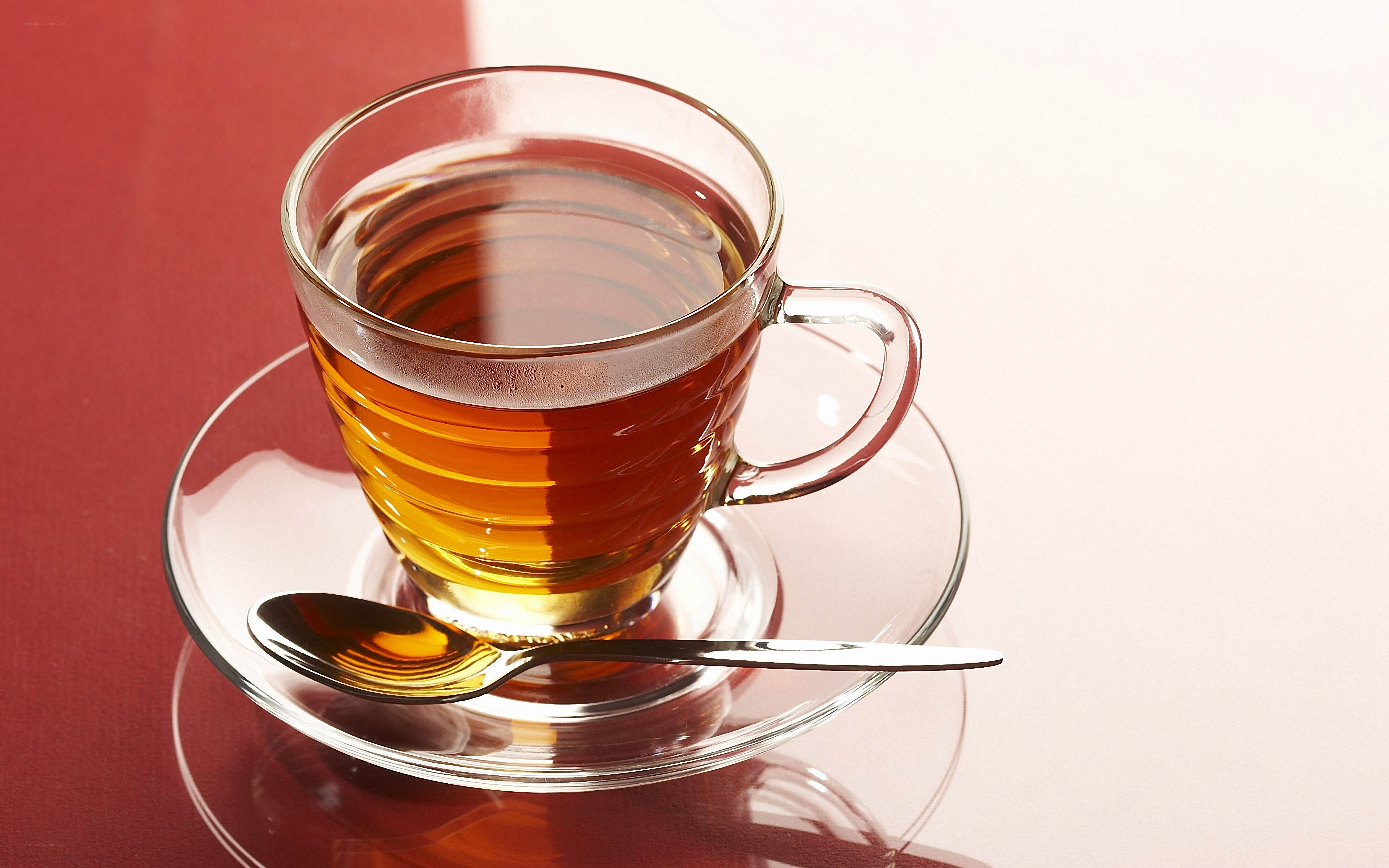 Teacup with tea and spoon