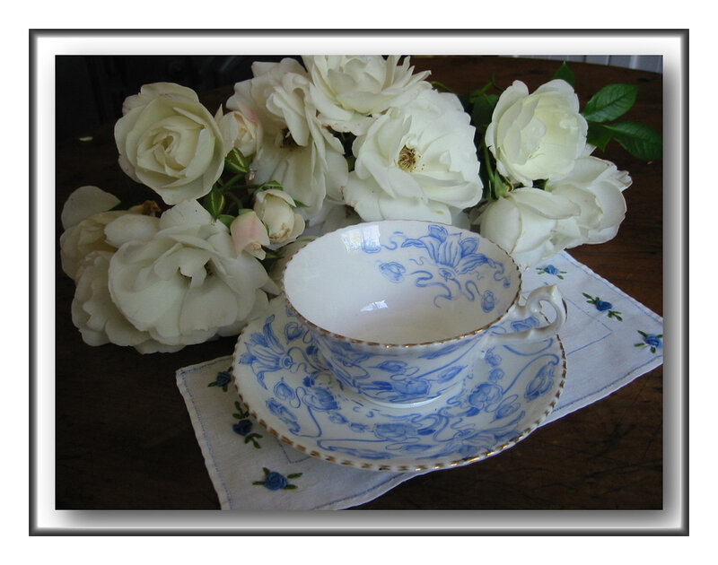 Teacup with white roses