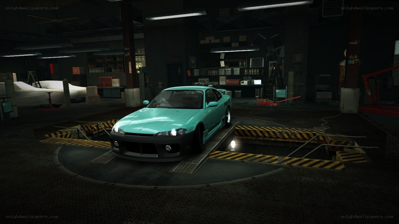 teal car in garage