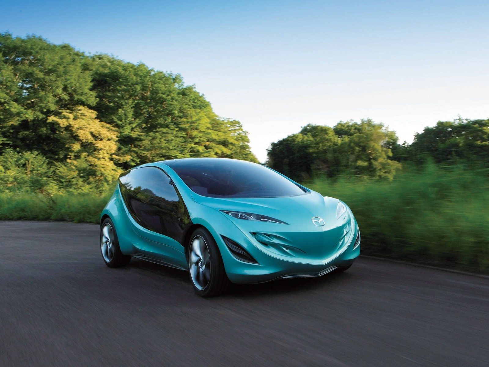 Teal concept car on road