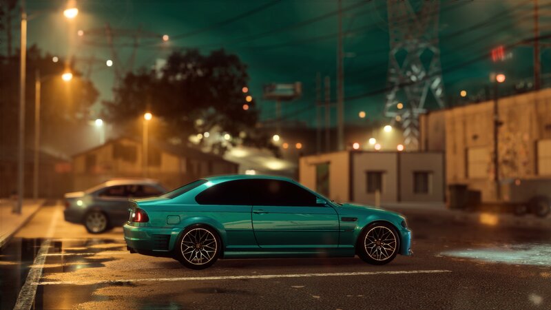 Teal Coupe on Wet Street