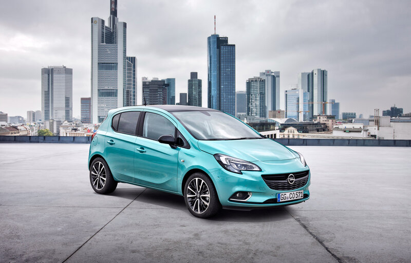 Teal Opel Corsa in city
