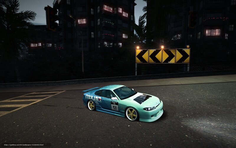 teal race car at night