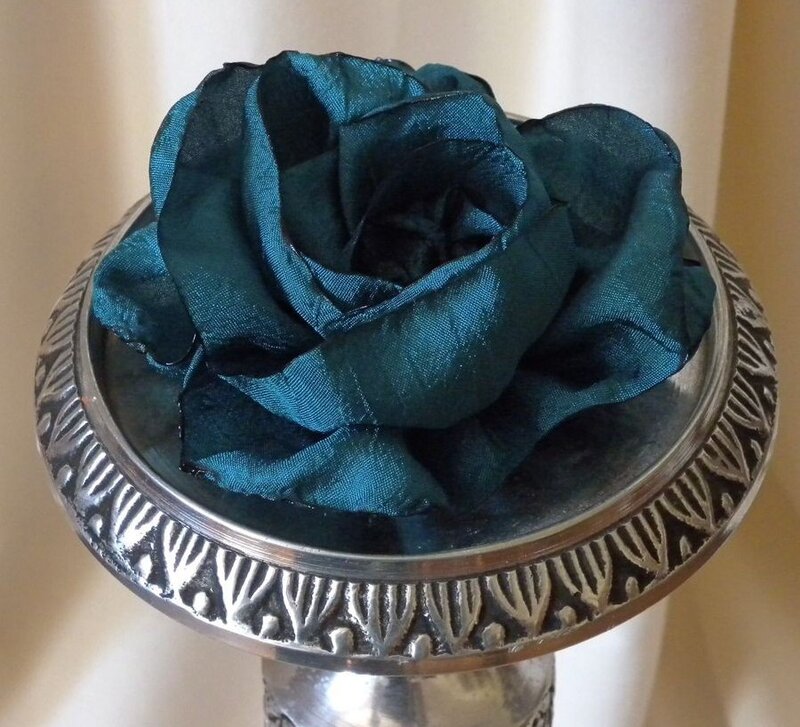 Teal silk rose on silver stand