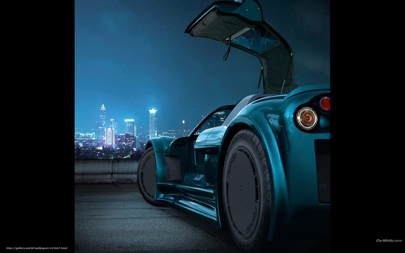 teal sports car at night