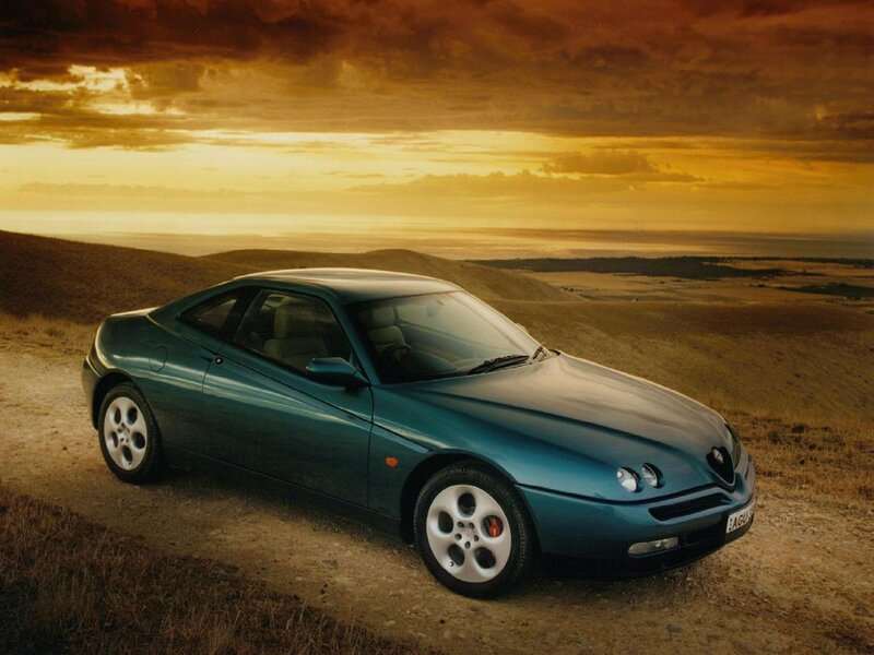 Teal sports car on a hill