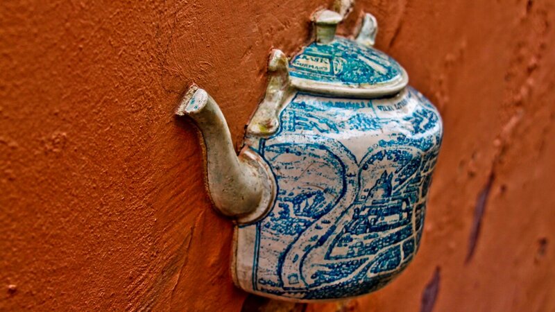 Teapot mounted on a wall