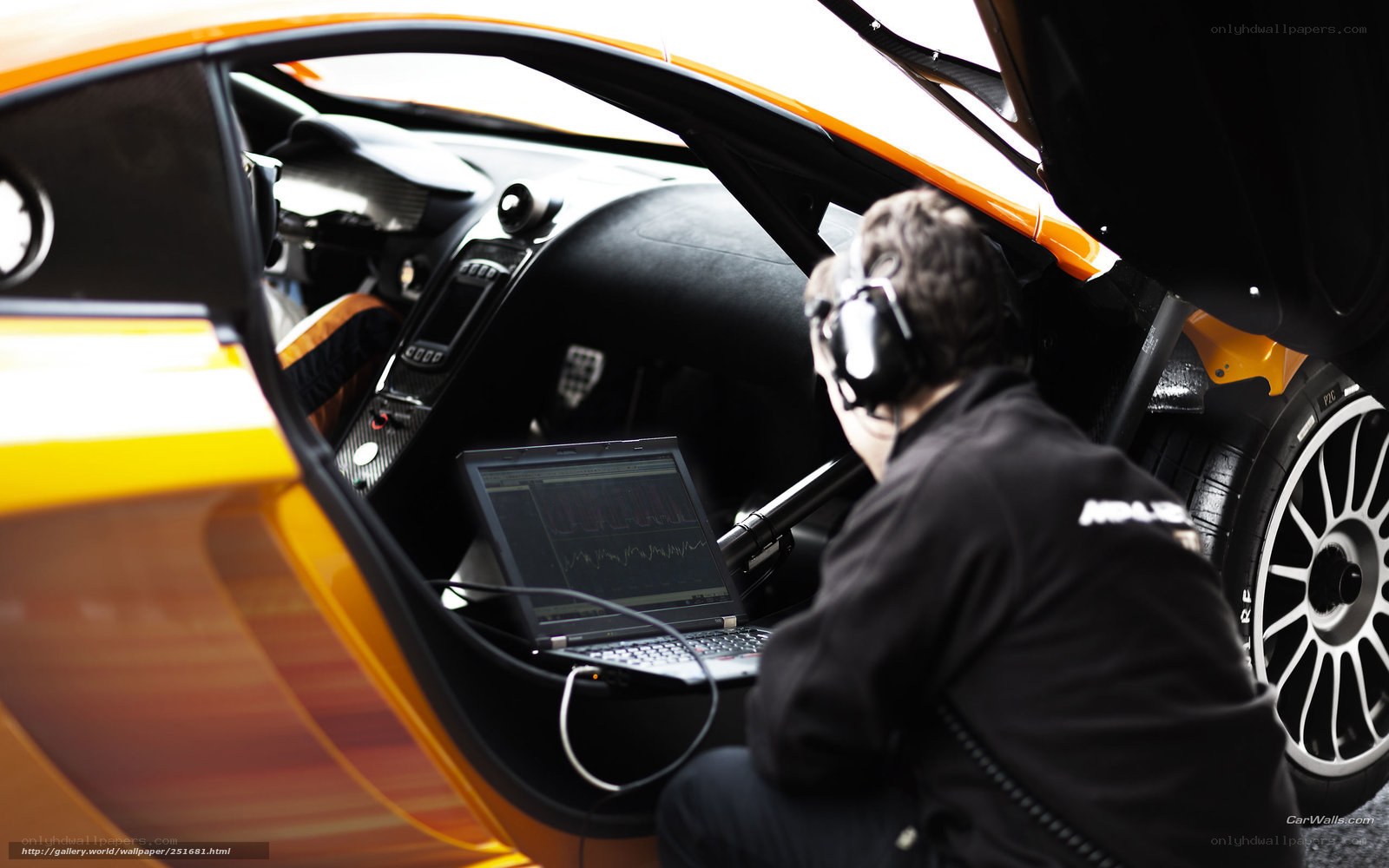 technician working on race car