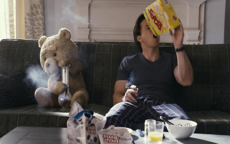 Ted and John on a couch