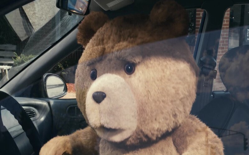 Ted the bear in a car