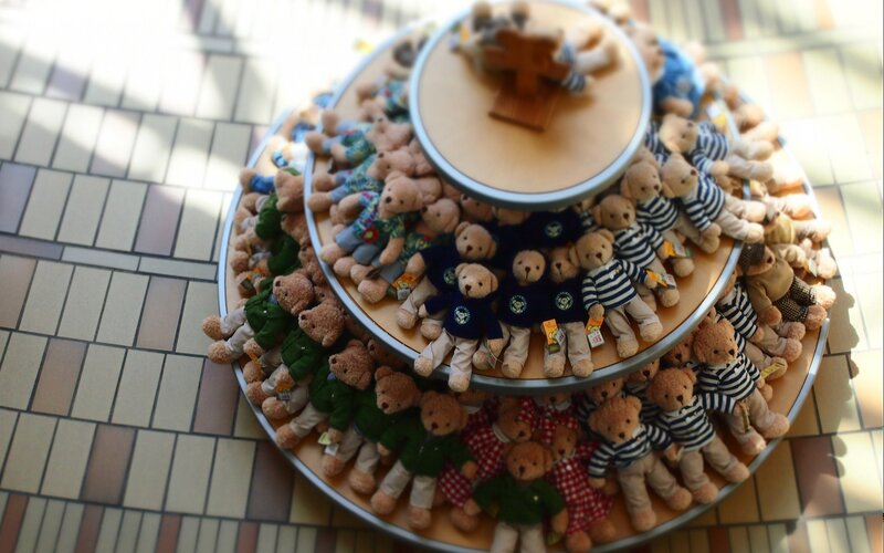 Teddy bear display on tiered stand