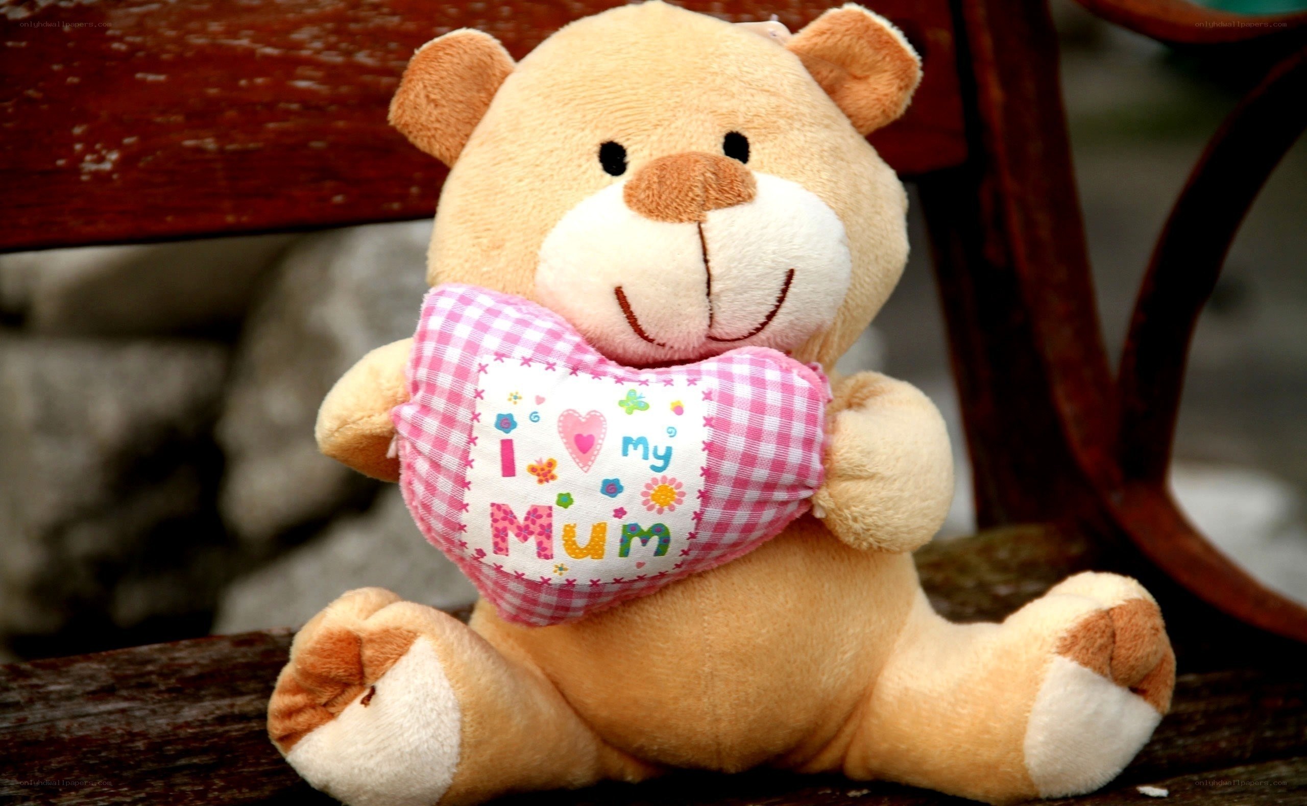 teddy bear holding heart