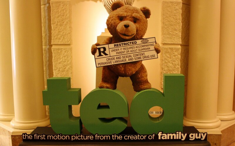 Teddy Bear Holding Sign