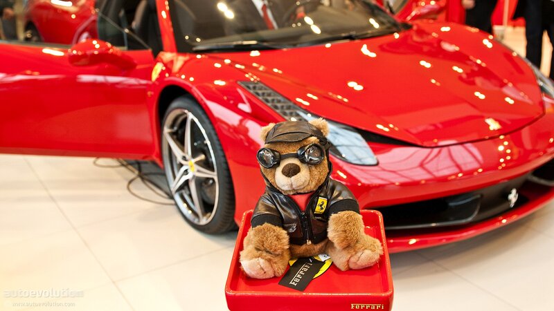 Teddy bear in front of Ferrari