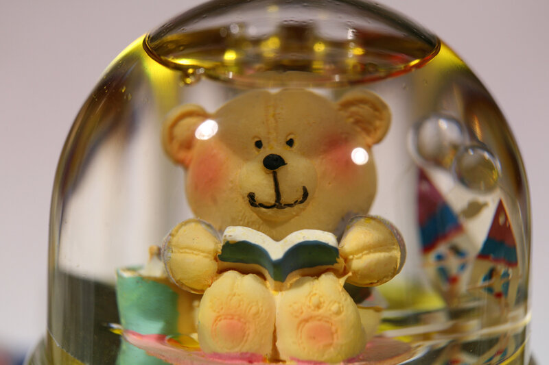 teddy bear in snow globe