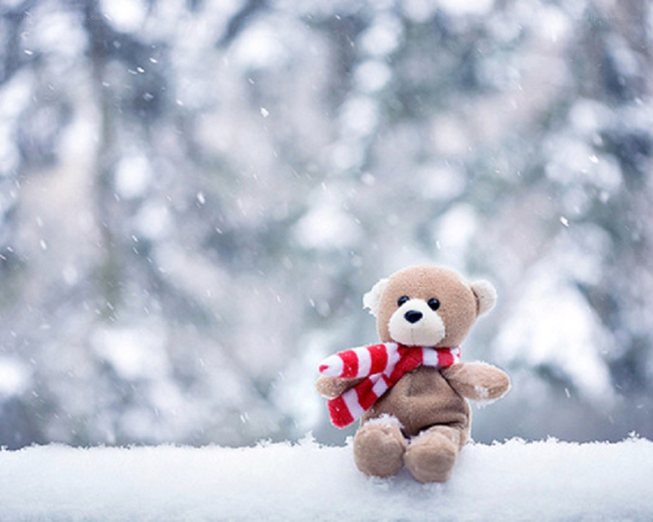 Teddy bear in snowy landscape