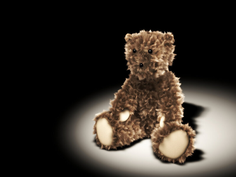 teddy bear in spotlight
