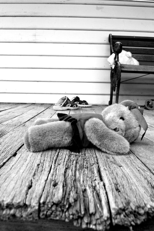 Teddy bear on a porch