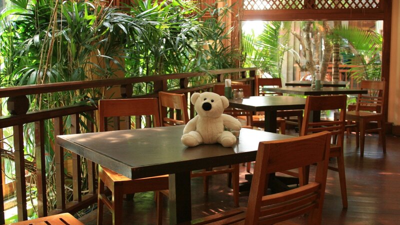 Teddy bear on a restaurant table