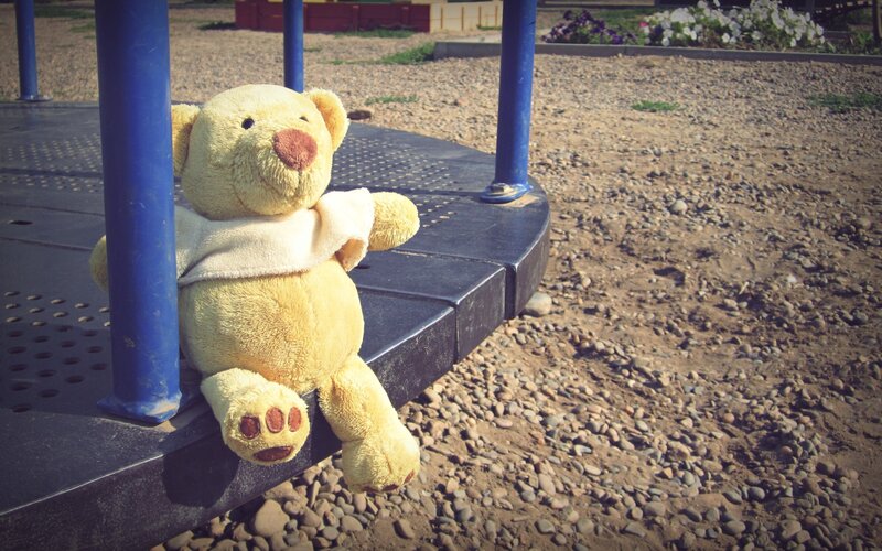 Teddy bear on playground