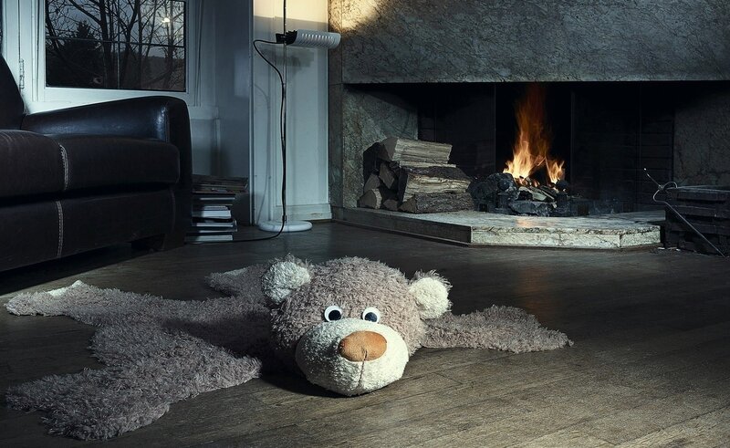 Teddy bear rug by fireplace