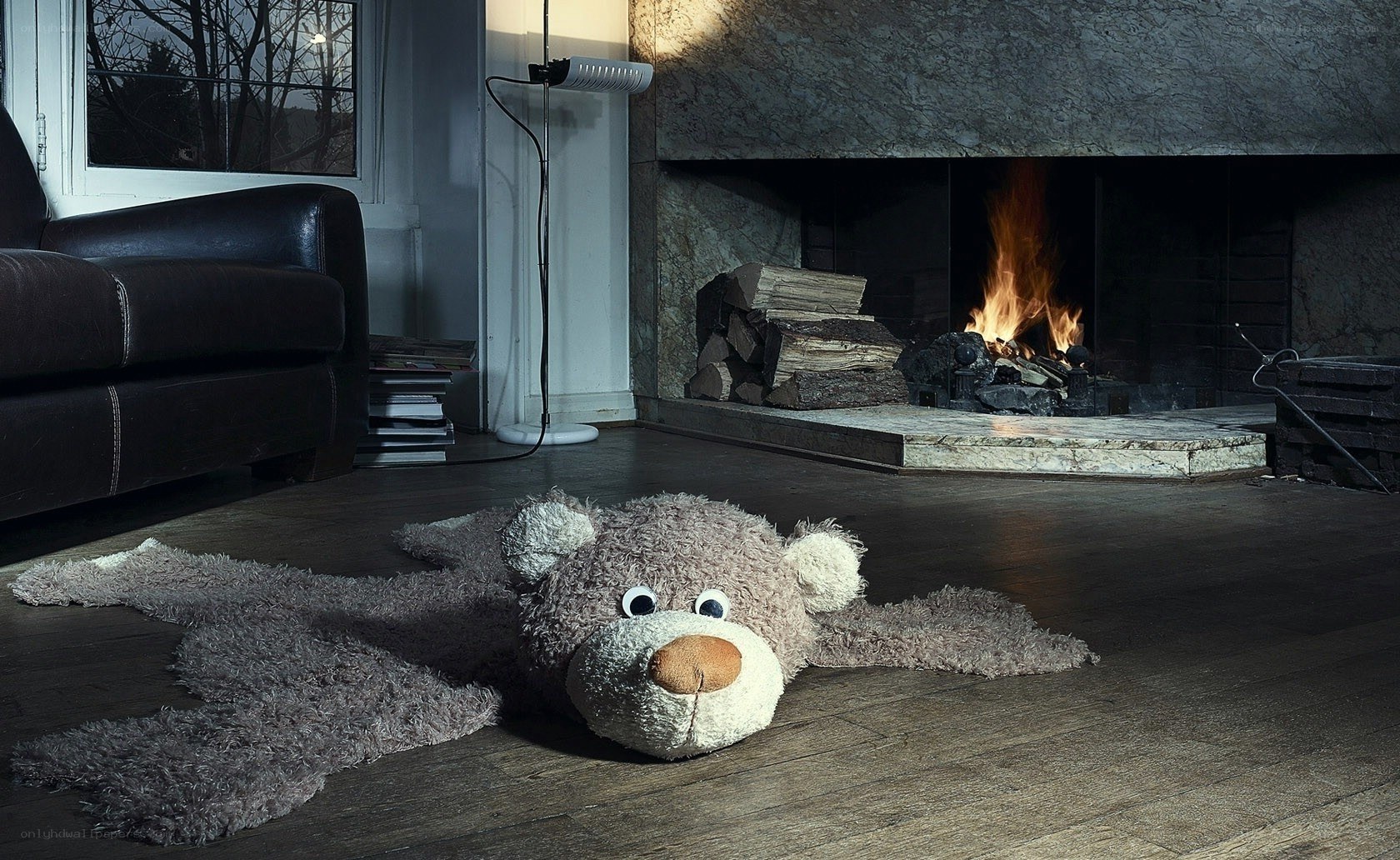 Teddy bear rug by fireplace