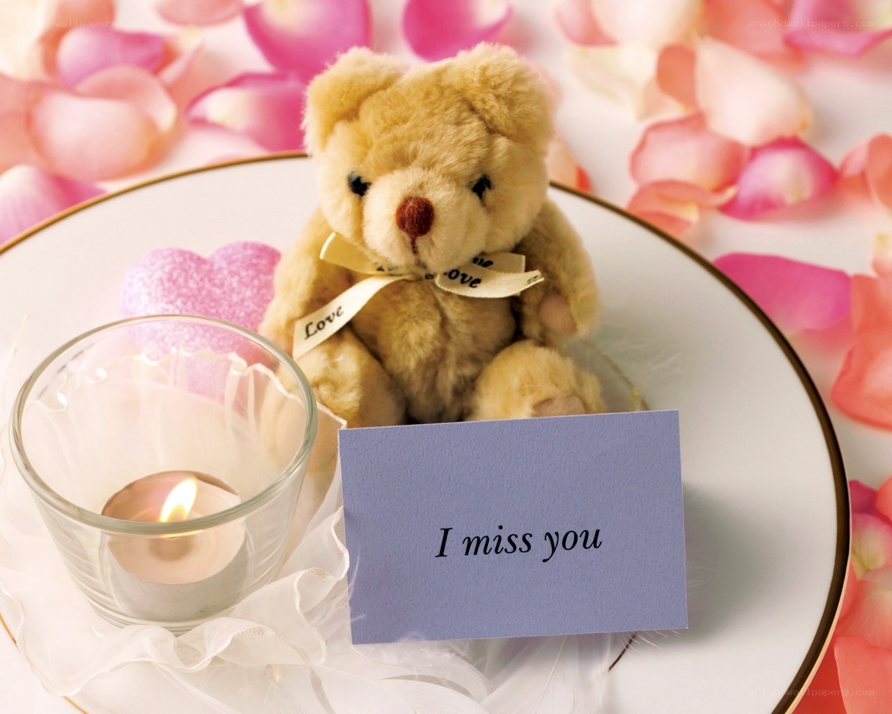 Teddy bear with candle and card