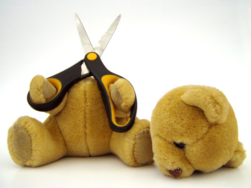 Teddy bear with scissors