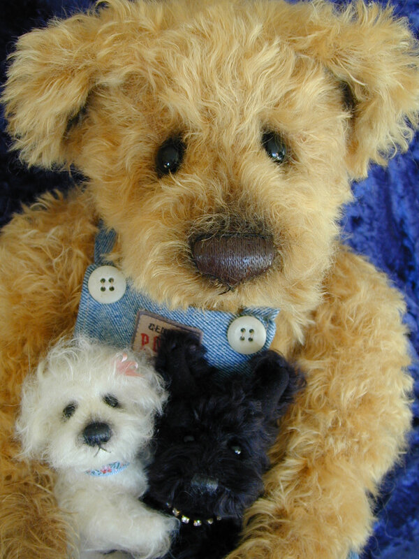 Teddy bear with two small dogs
