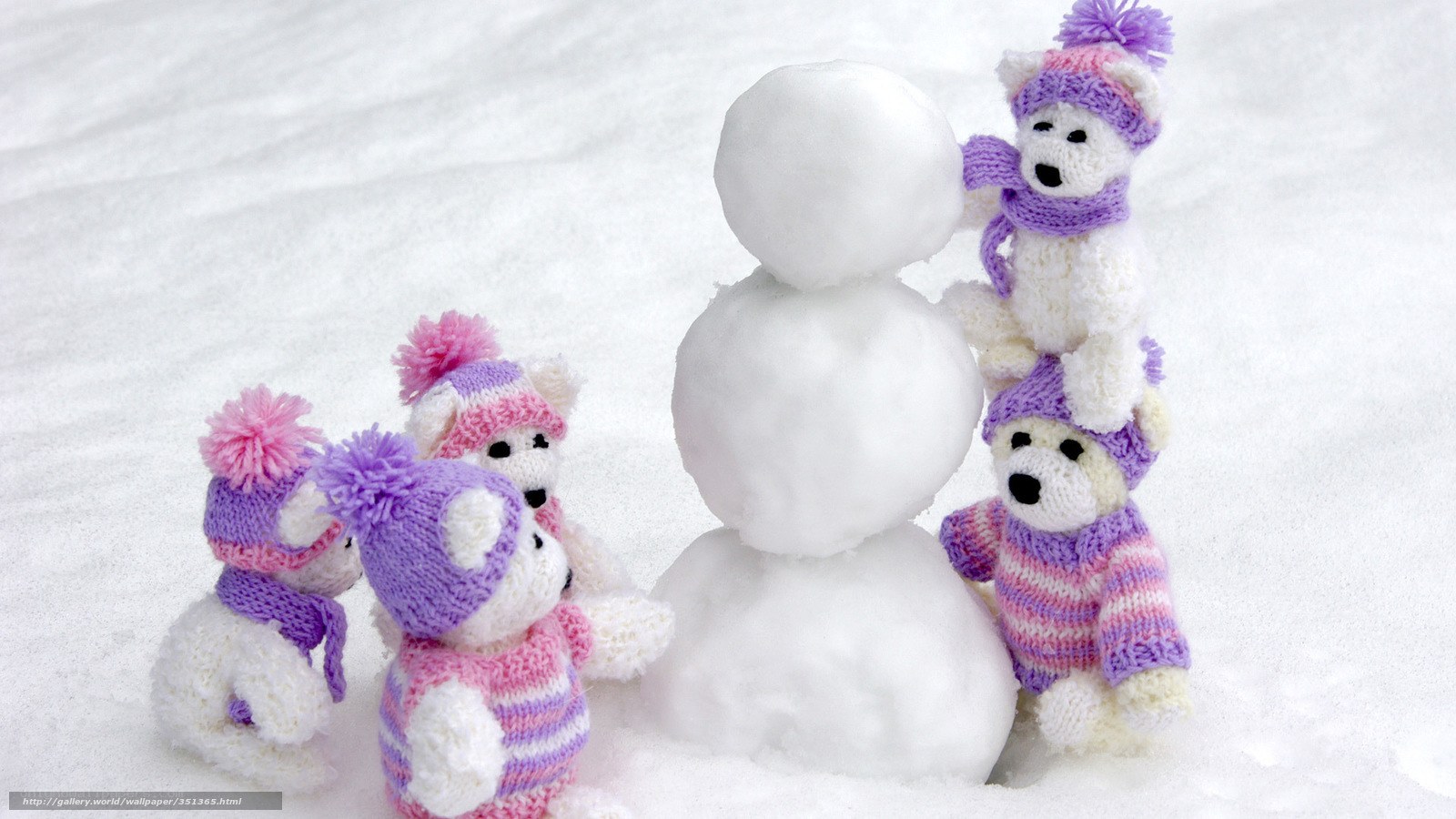 teddy bears building snowman