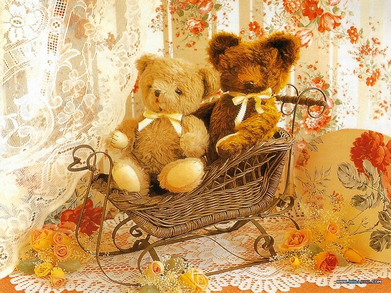 Teddy bears in a wicker sleigh