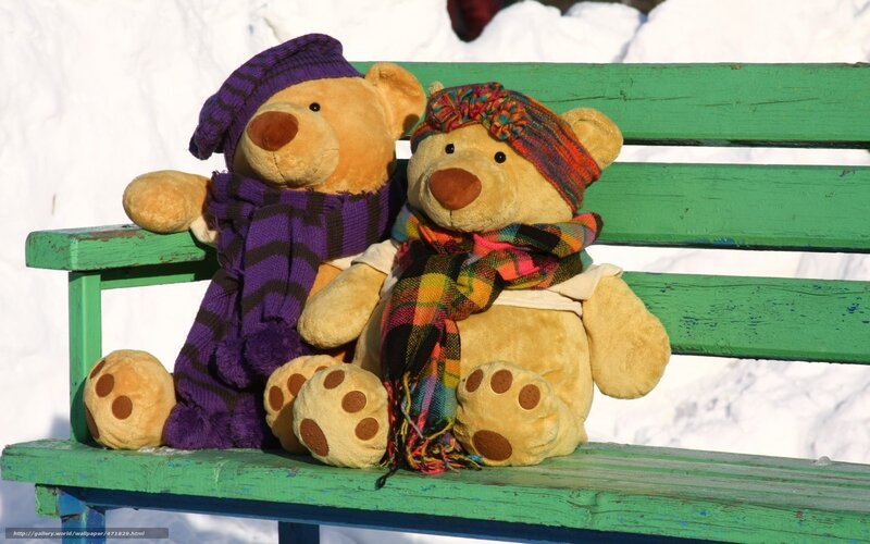 Teddy bears on a bench