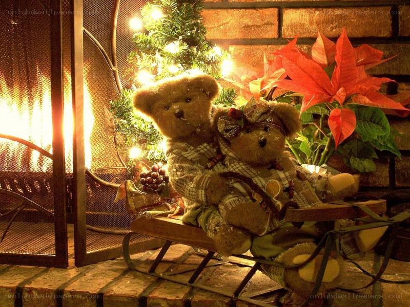 Teddy bears on a sled by fireplace