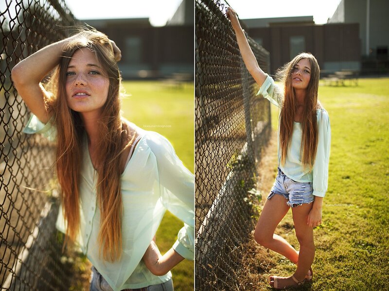 Teen girl by chain-link fence