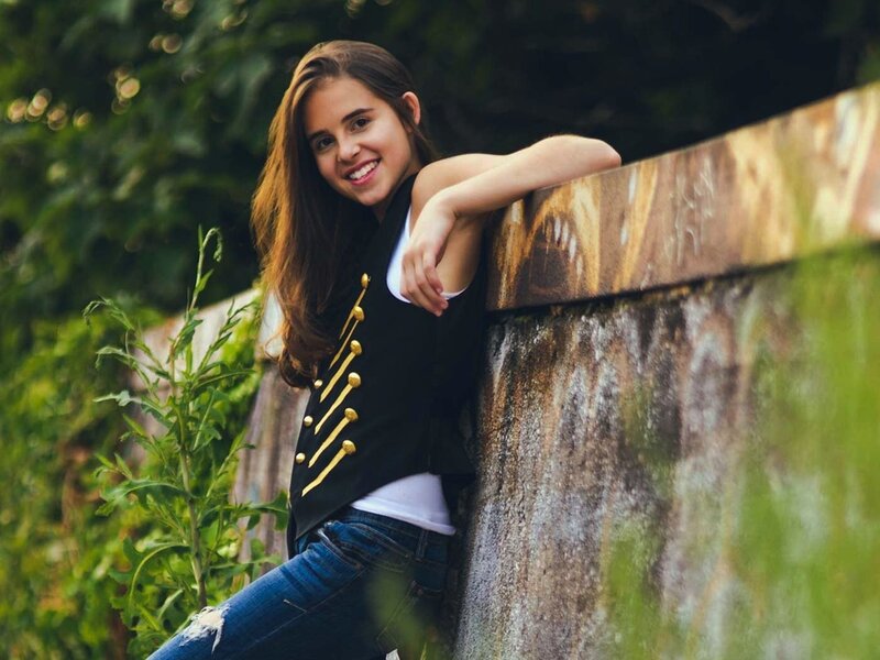 Teen Girl Leaning on Wall