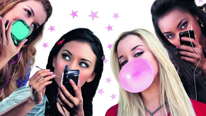 teen girls with phones and bubble gum